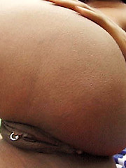 Sweety ebony girl relaxing with garden hose