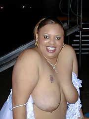 Fat chocolate woman posing outdoor