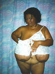 Black mamma shows her really monster tits