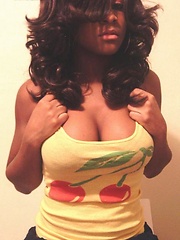 Busting out of her outfits while flaunting her cleavage